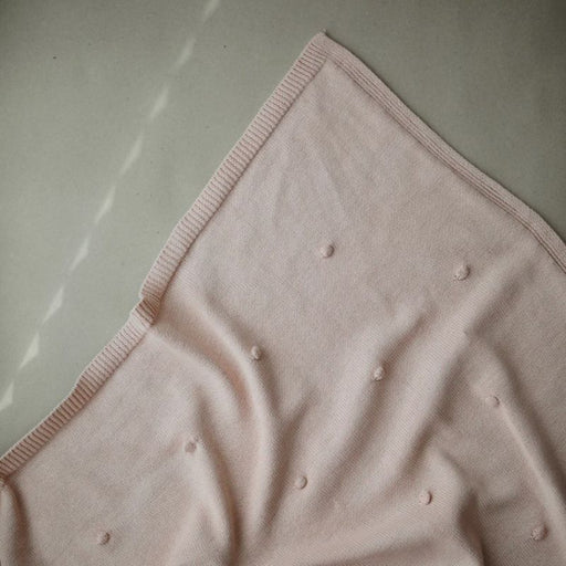 Couverture à pompoms en tricot de Mushie - Blush par Mushie - Maison | Jourès