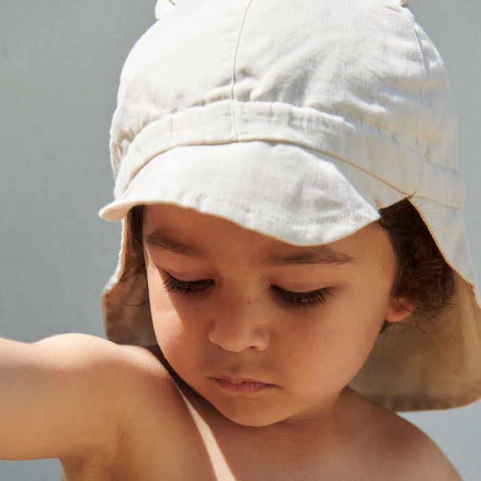Gorm Reversible Seersucker Sun Hat - 0m to 2Y - Blue Wave / Creme de la creme par Liewood - Sun hats | Jourès