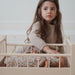 Lit en bois pour poupée par Konges Sløjd - Maison de poupée et accessoires | Jourès